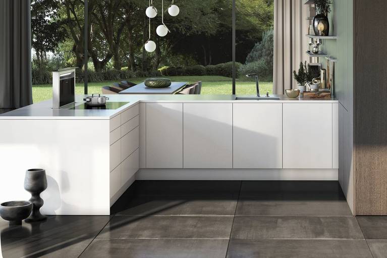 SieMatic Pure SE base cabinets in glossy lotus white SQ lacquer with downdraft extractor